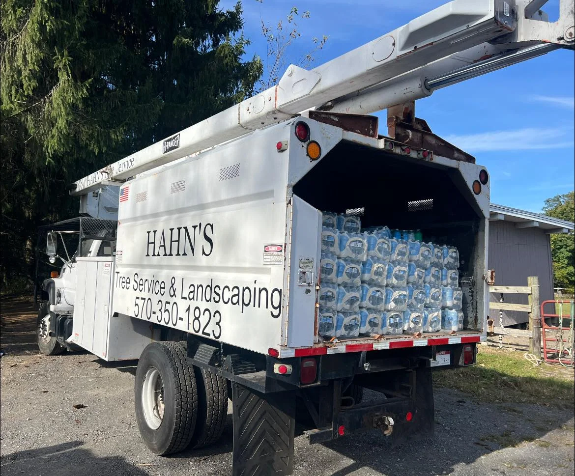 Company truck loaded with bottled water for community relief