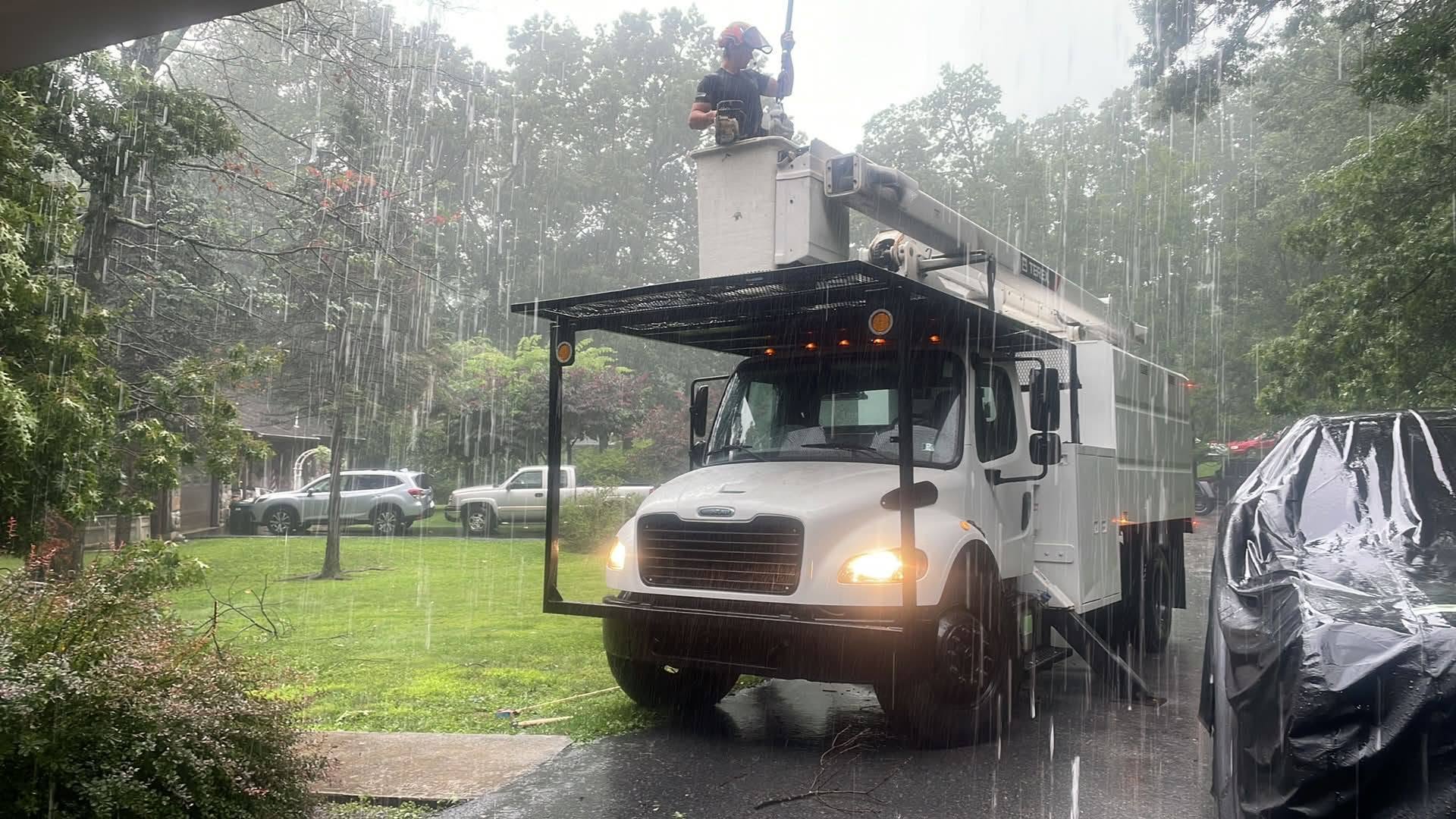 Hahn's Tree Service bucket truck working an emergency call in heavy rain near Stroudsburg PA